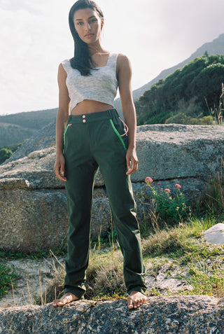 model wearing the water resistant outdoor pant in jungle